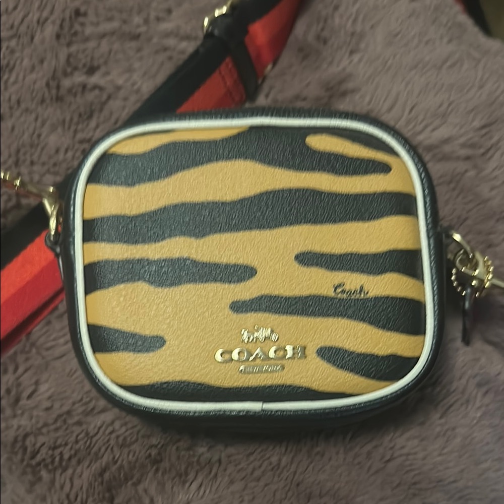 Coach Orange and Black Crossbody Bag with Safari-Inspired Design